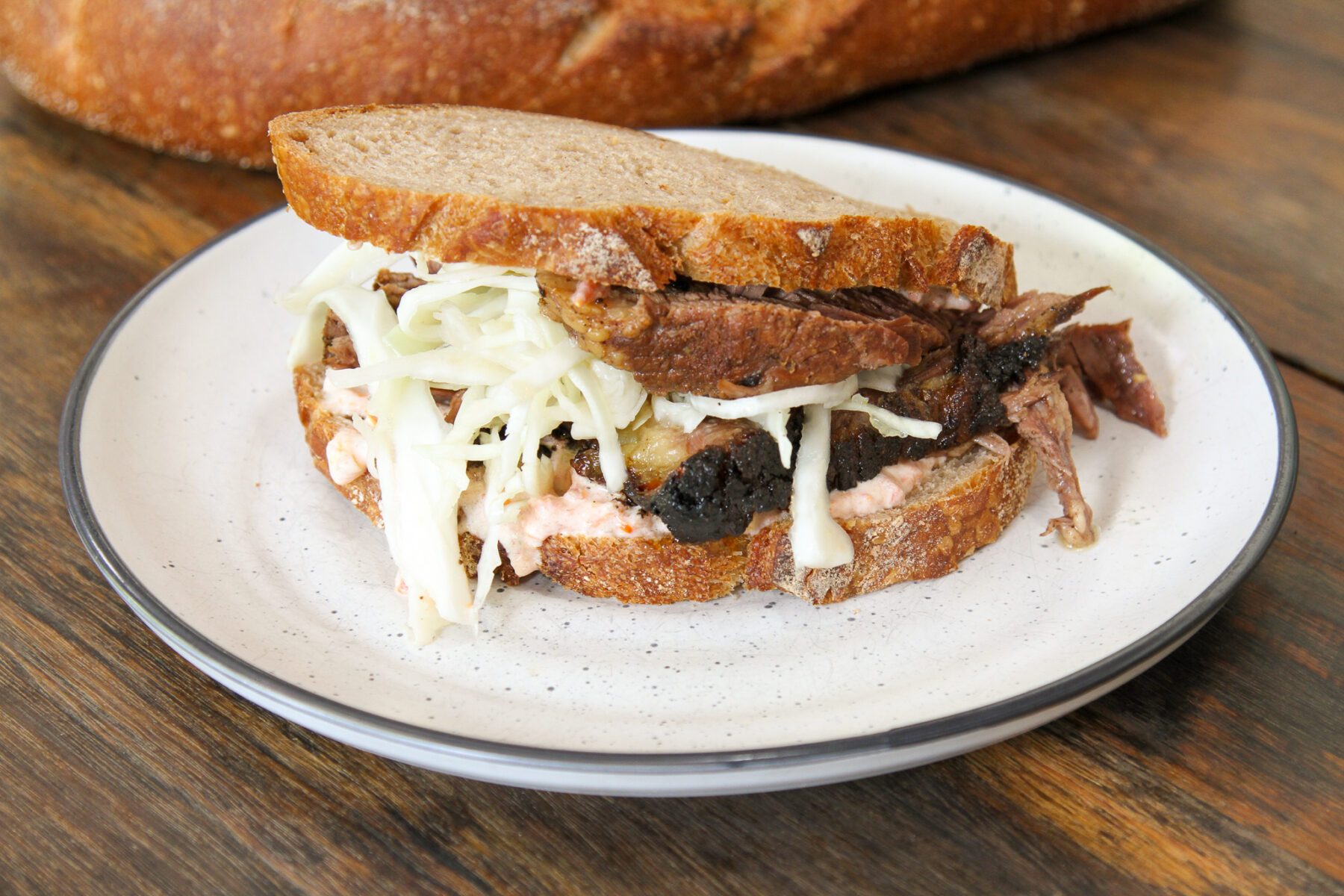 Slow cooked beef brisket shredded cabbage, tomato, mayo on New York Rye Sourdough